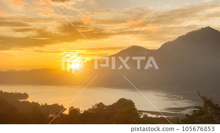 Stunning view on mount Abang and lake Batur at sunrise Stunning view on mount Abang and lake Batur at sunrise 105676853