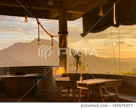Empty cafe on sunrise with view on Batur volcano Empty cafe on sunrise with view on Batur volcano 105676857