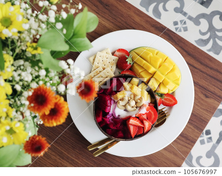 Smoothie bowl with mango, strawberry, dragon fruit Smoothie bowl with mango, strawberry, dragon fruit 105676997