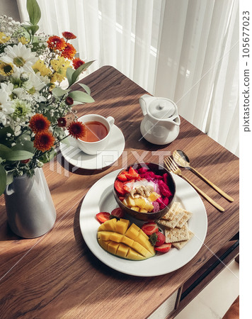 Smoothie bowl with mango, strawberry, dragon fruit 105677023