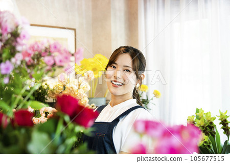 Flower shop staff portrait looking at the camera Flower shop staff portrait looking at the camera 105677515
