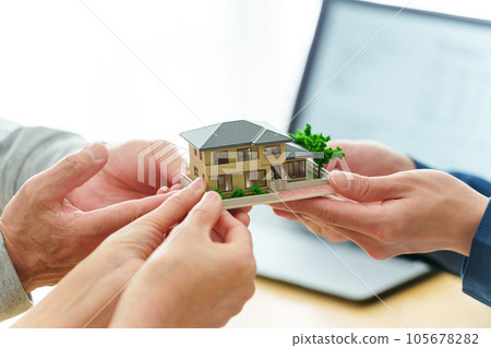 people with real estate models people with real estate models 105678282