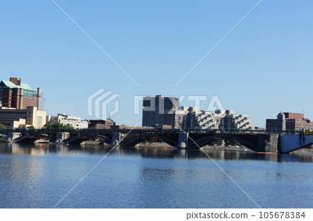 Cityscape reflected in the Boston Charles River Cityscape reflected in the Boston Charles River 105678384