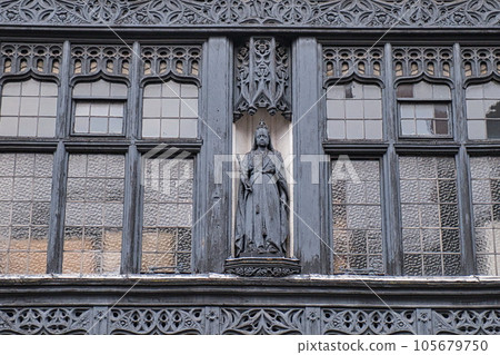 Carved figure on the wall of a building in Chester, England. Carved figure on the wall of a building in Chester, England. 105679750