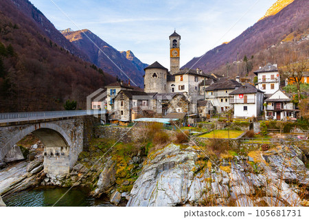 Alpine village of Lavertezzo on rocky slopes of mountain river Verzasca in winter, Switzerland 105681731