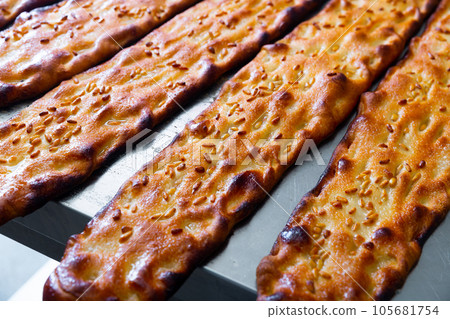 Appetizing hot sesame bread called coca Appetizing hot sesame bread called coca 105681754