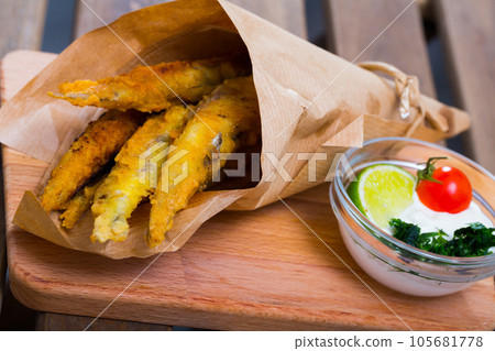 Tempura of fish with fried sardines and chips 105681778
