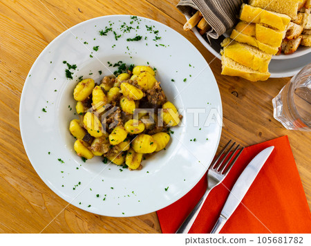 Gnocchi with mince and eggplant 105681782