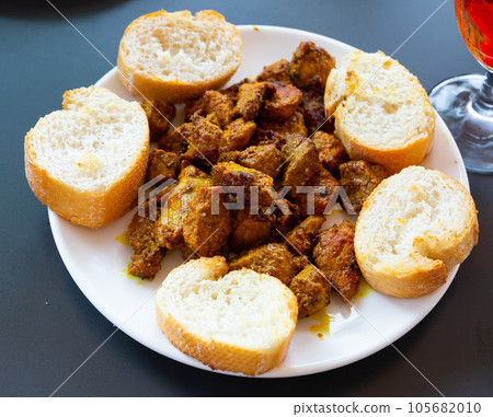 Pinchos morunos, moorish skewers with bread Pinchos morunos, moorish skewers with bread 105682010