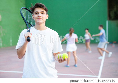 Portrait of caucasian man frontenis player in outdoor court Portrait of caucasian man frontenis player in outdoor court 105682319