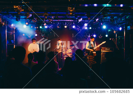 A young band man performing live at a live house 105682685