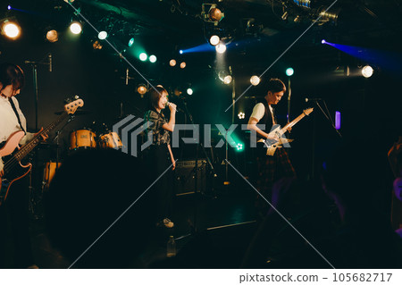 A young band man performing live at a live house A young band man performing live at a live house 105682717