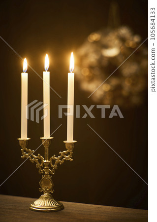 Candlelight and Christmas wreath Candlelight and Christmas wreath 105684133