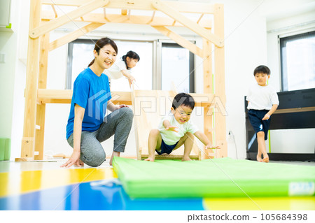 Indoor childcare image _ mat exercise 105684398