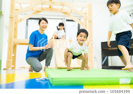 Indoor childcare image _ mat exercise Indoor childcare image _ mat exercise 105684399