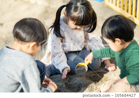 Children playing in the sandbox Children playing in the sandbox 105684427