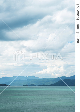 Breathtaking oceanic and mountains landscape. Maritime summery background. Breathtaking oceanic and mountains landscape. Maritime summery background. 105684971