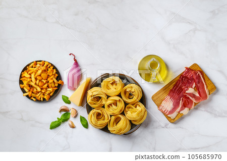 Raw fettuccine and ingredients for mushroom pasta 105685970