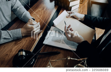 Clients come to seek advice for the law regarding privacy violations with the lawyer at the office. Clients come to seek advice for the law regarding privacy violations with the lawyer at the office. 105686089