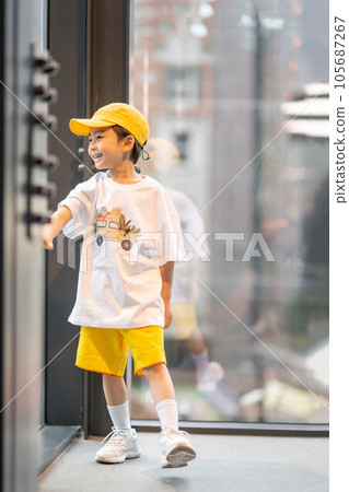 little boy in yellow hat and smiling little boy in yellow hat and smiling 105687267