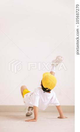 little boy in yellow hat and smiling 105687270