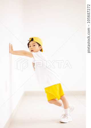 little boy in yellow hat and smiling 105687272
