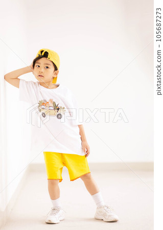 little boy in yellow hat and smiling 105687273