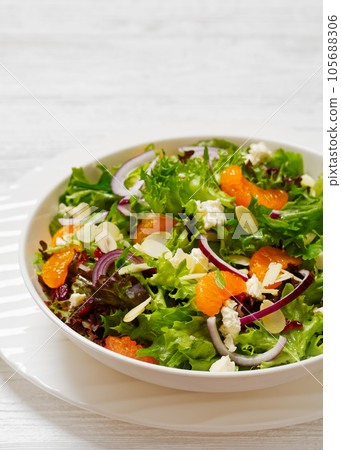 Mandarin Orange Salad in white bowl, top view 105688306