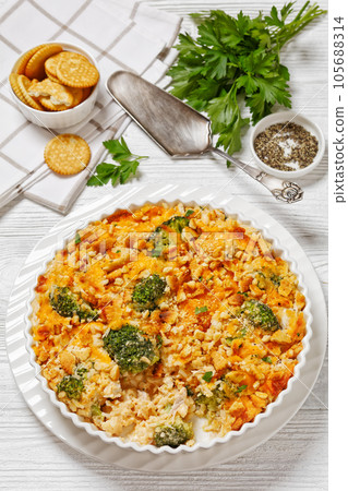 chicken rice broccoli casserole in baking dish 105688314