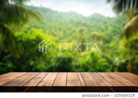 Wooden table top on blurred green jungle background - can be used for display or montage of your products 105689329