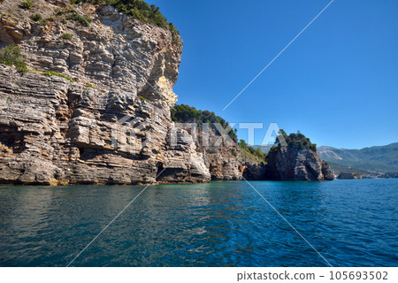 Picturesque view of the cliffs from the sea. Budva riviera, Montenegro 105693502