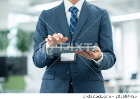 Young recruit male businessman working in office Young recruit male businessman working in office 105694450