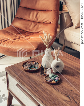 Decorative lava stone vases with dry flowers and healing crystals Decorative lava stone vases with dry flowers and healing crystals 105695429