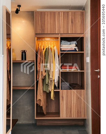 Wardrobe with clothes Wardrobe with clothes 105695440