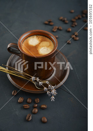 Cup of coffee with coffee beans 105695582