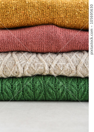 Pile of hand knitted winter clothes Pile of hand knitted winter clothes 105695630