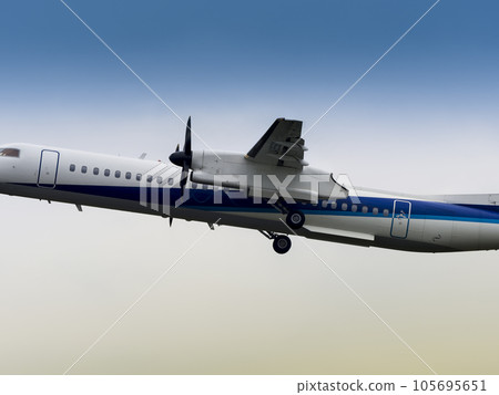 Passenger plane flying in cloudy sky Passenger plane flying in cloudy sky 105695651
