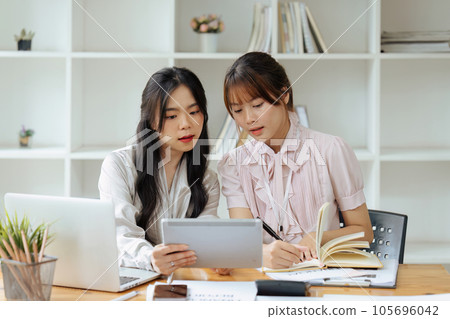 Financier or Analyst Colleagues Discussing a New project Opportunity, Talking in an Office Meeting Room. 105696042