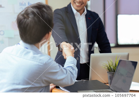 Closeup Handshake of employees after successful planning strategy marketing in the office 105697704