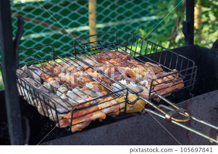 Meat on the black grill close up Meat on the black grill close up 105697841