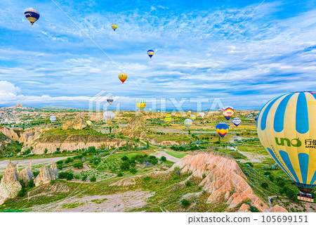Cappadocia, Turkiye - July 07, 2023-Air balloons in Cappadocia-amazing and unreal views in valley. 105699151