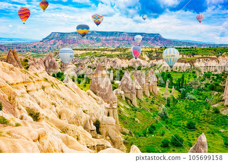 Cappadocia, Turkiye - July 06, 2023-Air balloons in Cappadocia - Valley of Love, Turkiye. Cappadocia, Turkiye - July 06, 2023-Air balloons in Cappadocia - Valley of Love, Turkiye. 105699158
