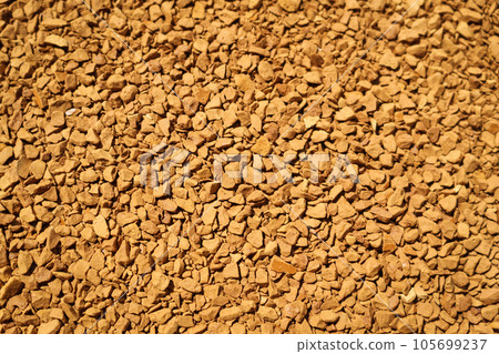 Background of coffee granules at life-size magnification. Background of coffee granules at life-size magnification. 105699237
