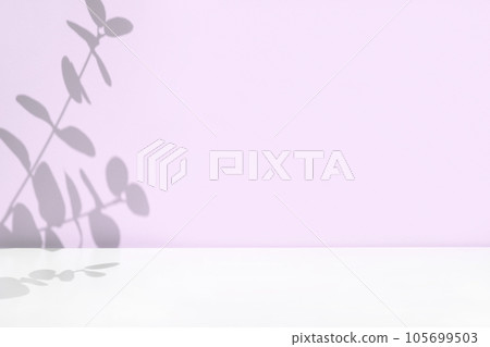 Plant shadows on violet color wall. Leaves shadow background. Branches, flowers and foliage on pastel studio background. Product presentation, Minimal mock up for advertising. Trendy Overlay effect Plant shadows on violet color wall. Leaves shadow background. Branches, flowers and foliage on pastel studio background. Product presentation, Minimal mock up for advertising. Trendy Overlay effect 105699503