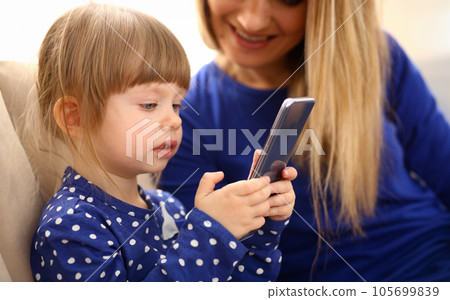 Cute little girl on floor carpet with mom Cute little girl on floor carpet with mom 105699839