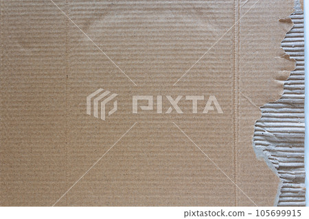 A Piece of cardboard paper texture background with a torned edge A Piece of cardboard paper texture background with a torned edge 105699915