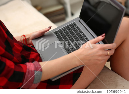 young woman hold laptop in arms work young woman hold laptop in arms work 105699941