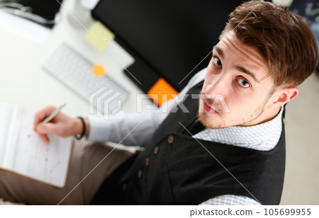 Young smile man at office workspace closeup 105699955