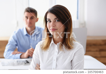 Beautiful smiling businesswoman portrait at workplace 105700463