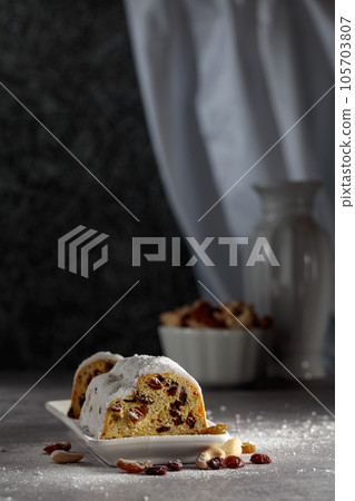 Traditional fruit cake for Christmas with raisins and nuts. Traditional fruit cake for Christmas with raisins and nuts. 105703807